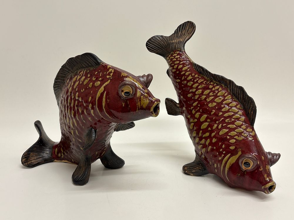 Lot 390: A pair of glazed ceramic koi fish figurines