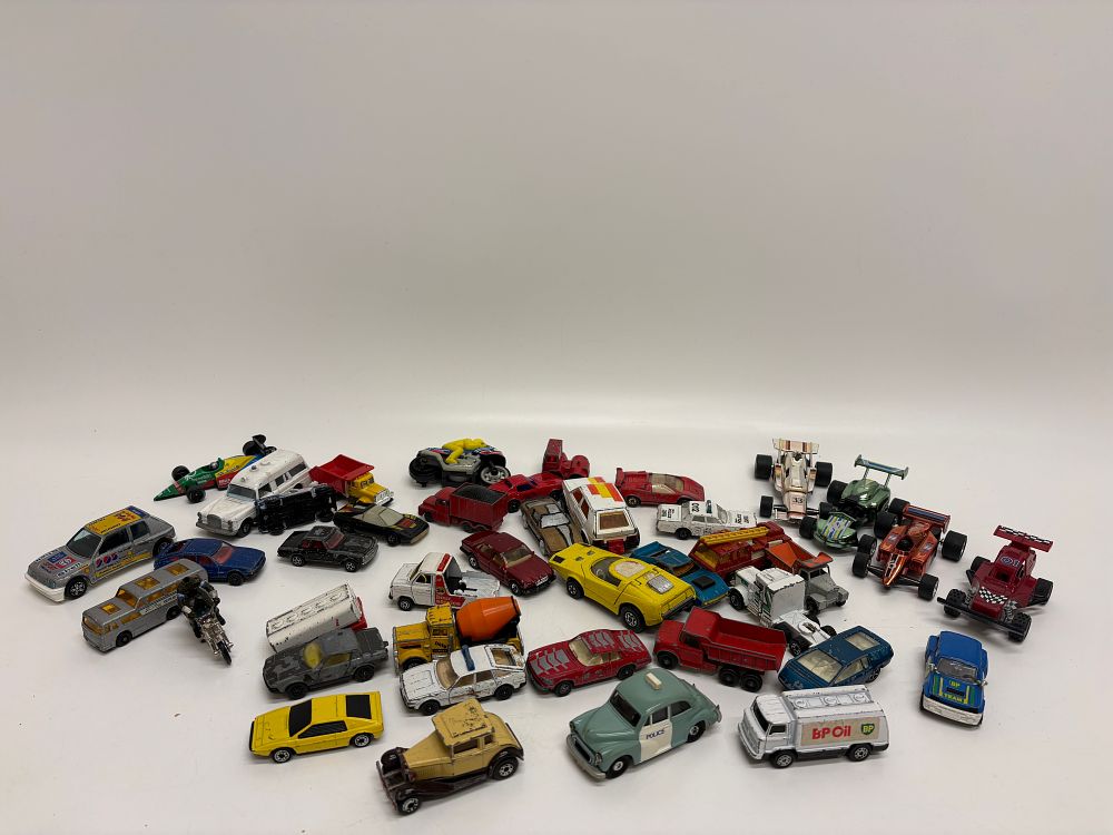 Lot 458: An Assortment of Vintage Die-Cast and Plastic Toy Vehicles