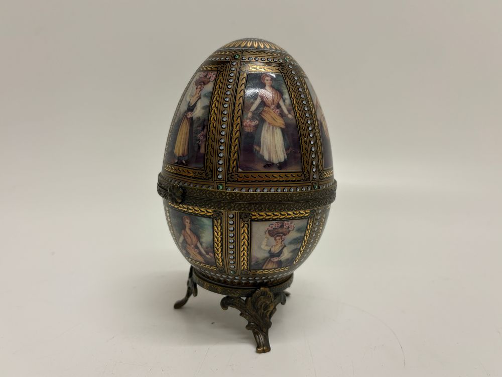 Lot 213: A Continental Jewelled Porcelain Egg Box on Gilt Metal Stand