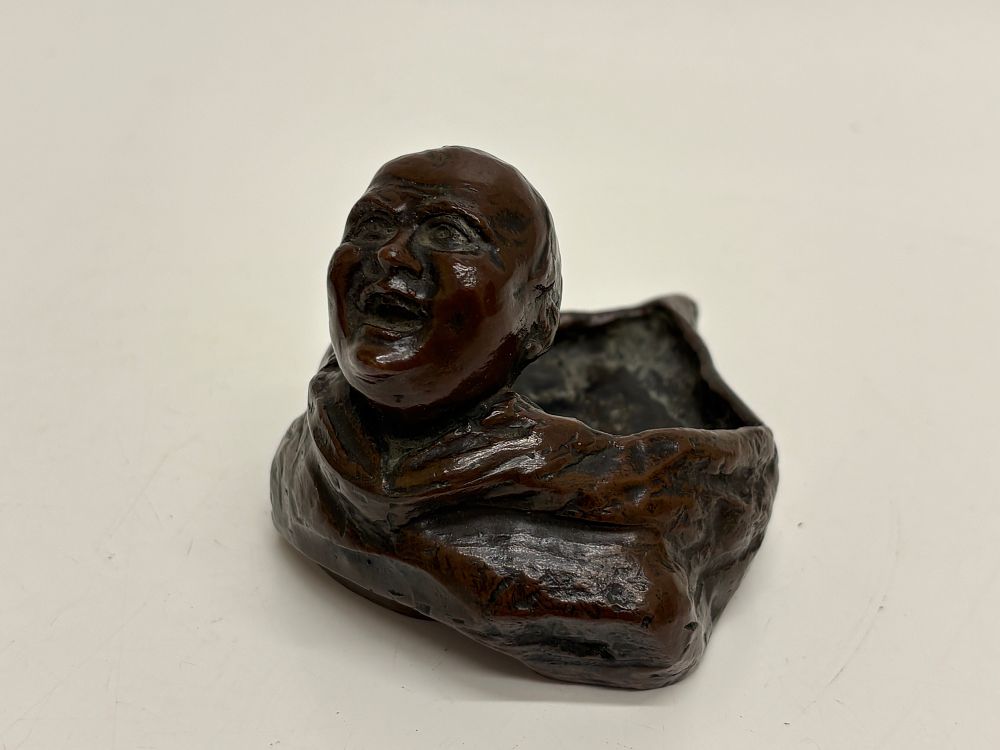 Lot 217: A Japanese patinated bronze figure of Daruma.