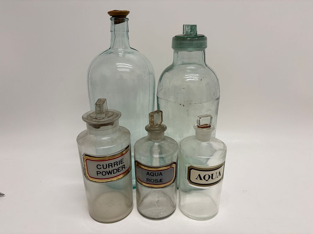 Lot 499: A Collection of Antique Glass Apothecary Shop Rounds and Storage Bottles