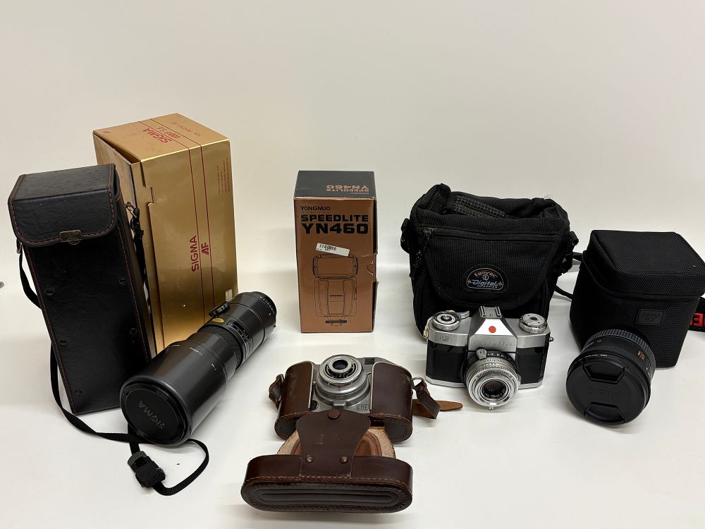 Lot 514: An Assortment of Photographic Equipment Including Zeiss Ikon and Bencini Cameras with Sigma Lenses