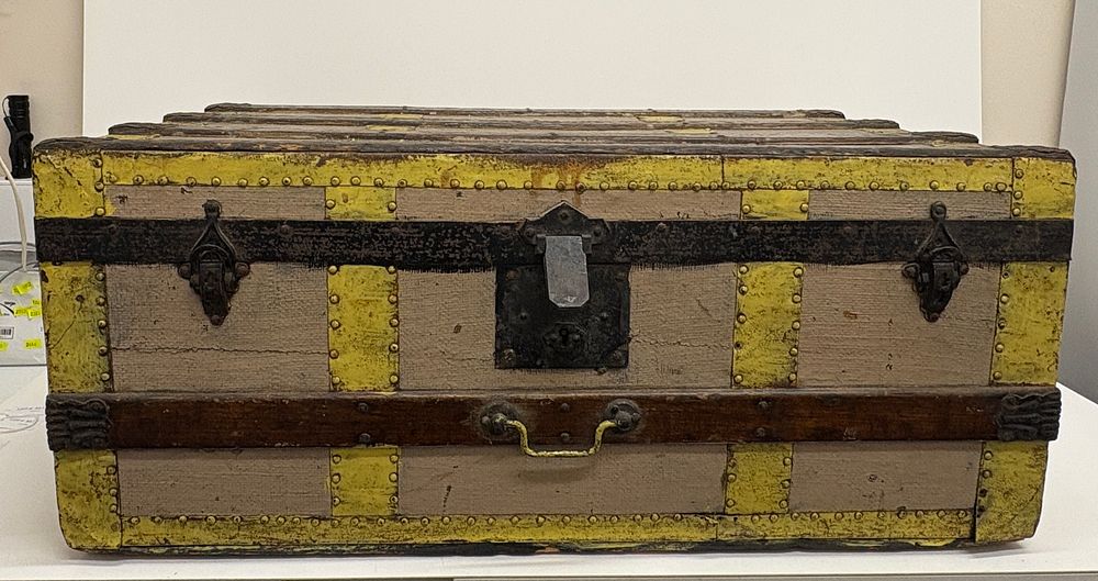 Lot 516: A Victorian metal mounted and painted oak slat steamer trunk