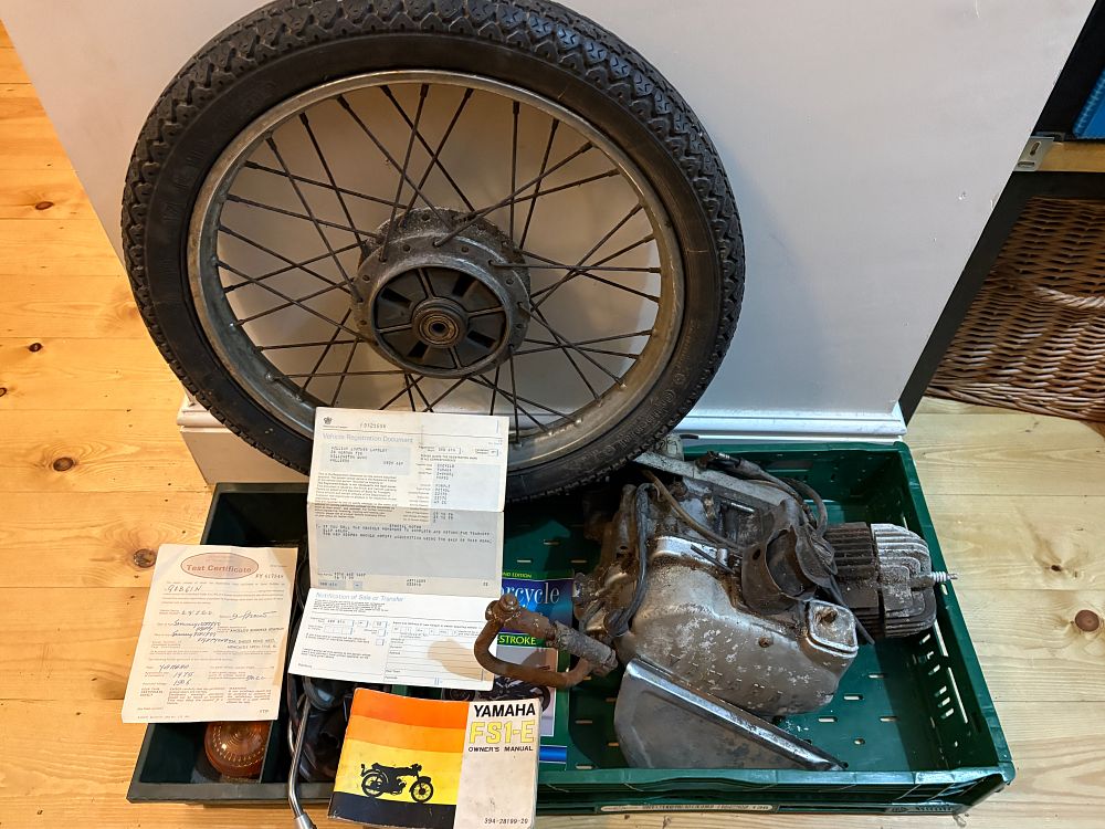 Lot 517: A Collection of Yamaha FS1-E Moped Parts and Original Documentation