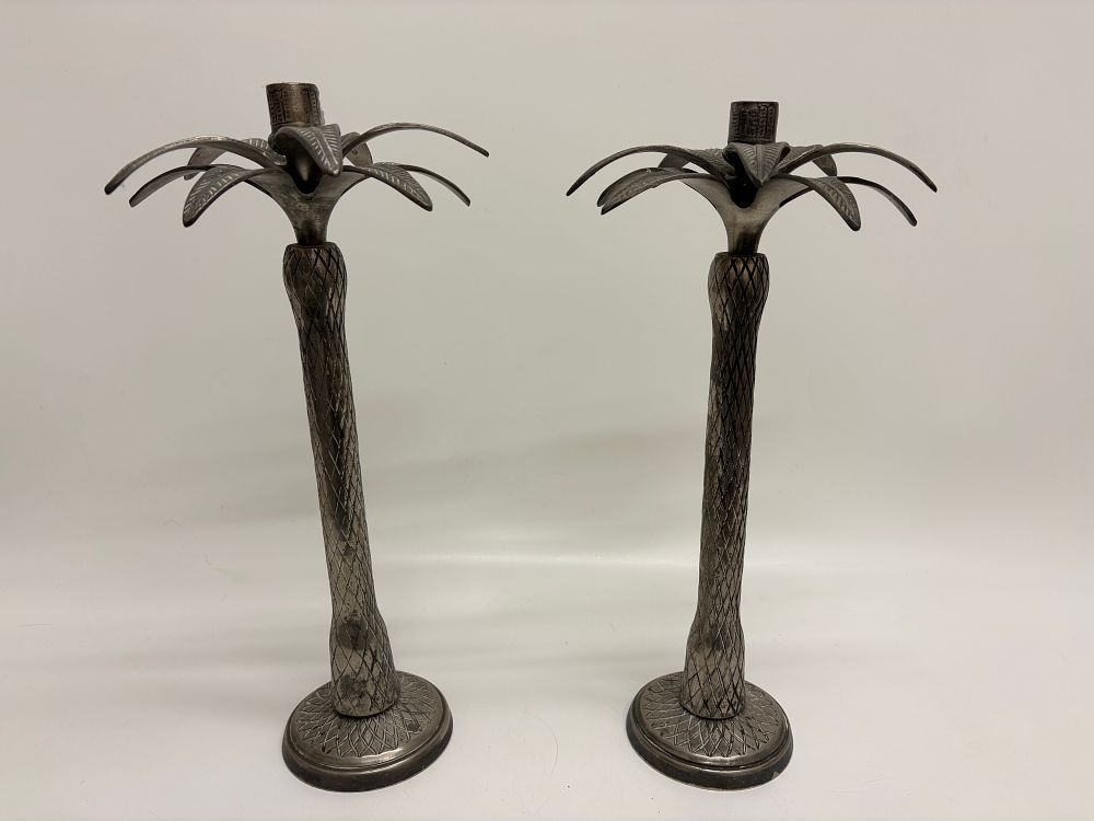 Lot 414: A Pair of Good Earth Cast Metal Palm Tree Candlesticks 42cm tall