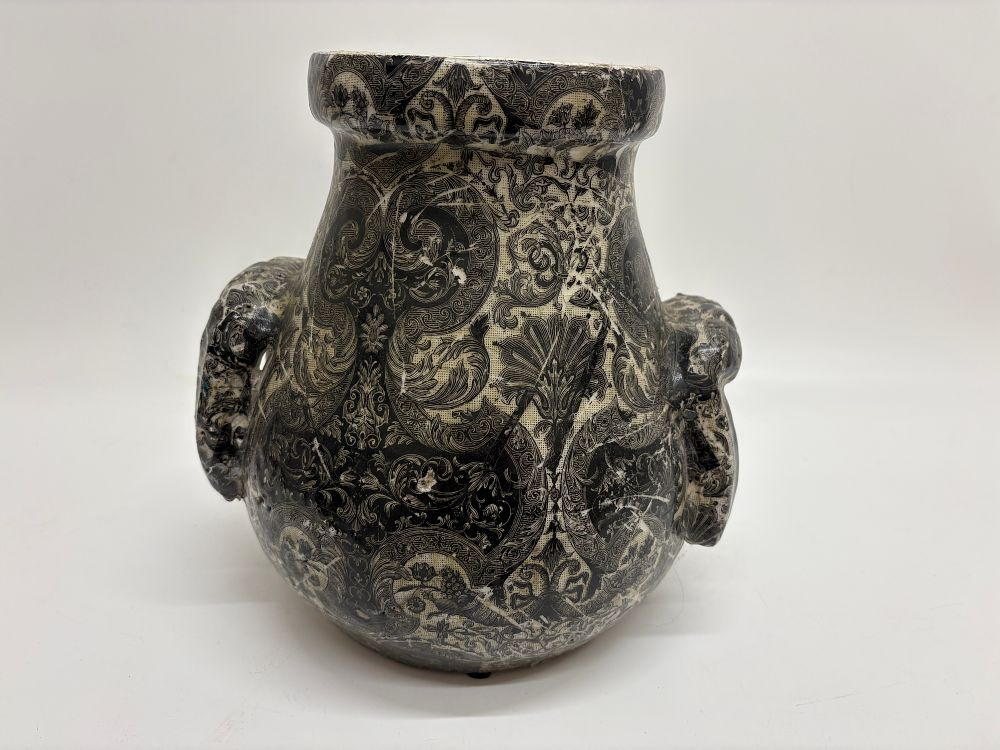 Lot 422: A twin-handled earthenware urn with black transfer-printed foliate decoration 38cm tall
