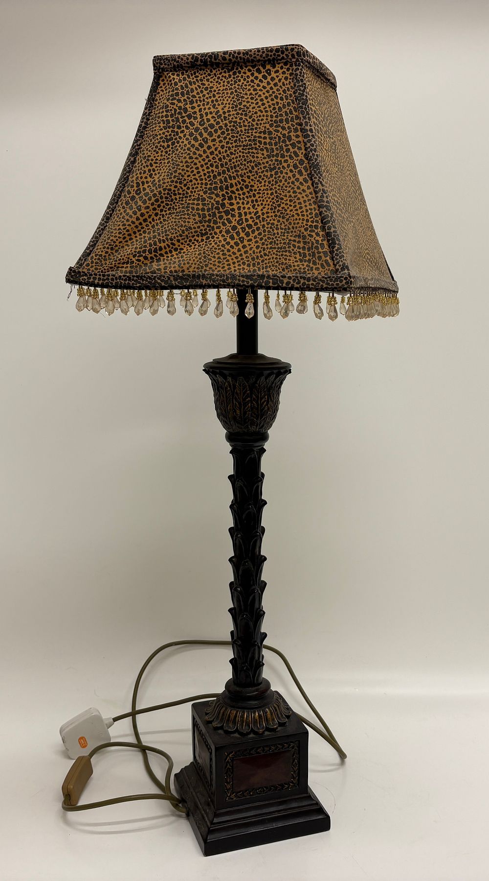Lot 424: A Composite Column Style Table Lamp with Leopard Print Shade and Beaded Fringe