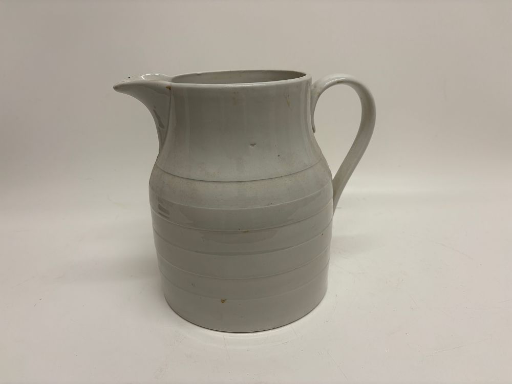 Lot 427: A White Glazed Banded Ironstone Dairy Pitcher 24x267cm
