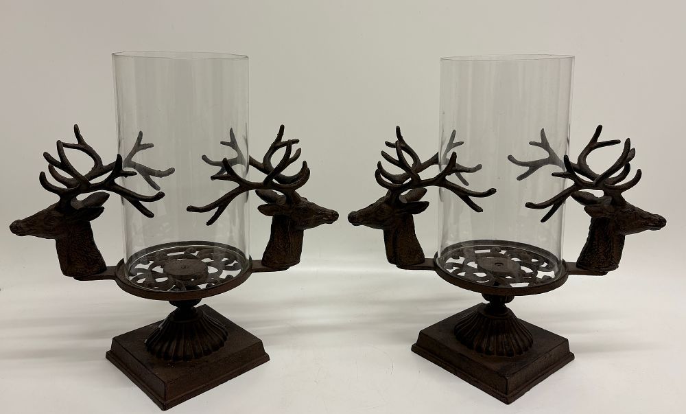 Lot 429: A Pair of Cast Metal Stag Pattern Hurricane Candle Holders