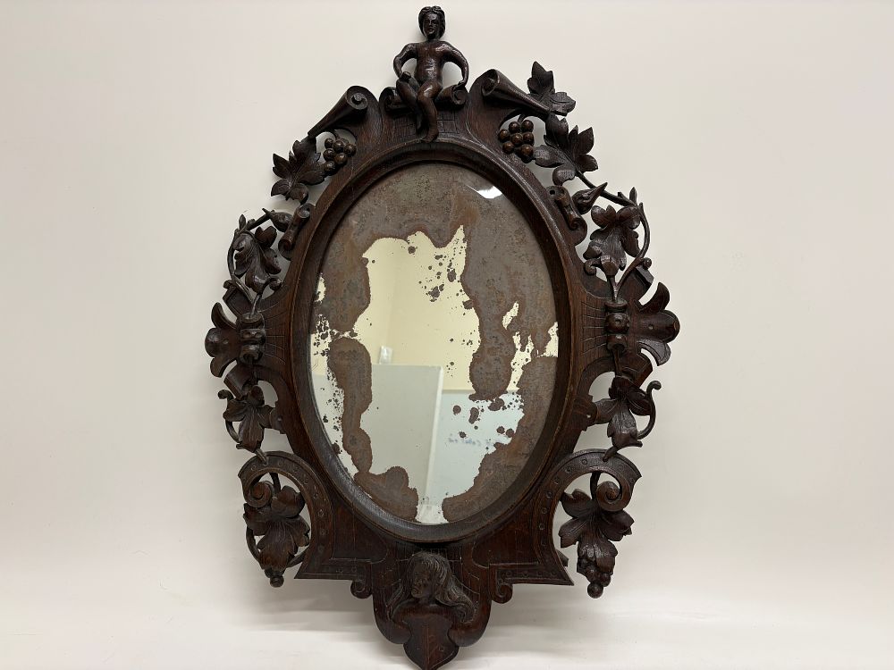 Lot 440: A Flemish Baroque Style Carved Oak Oval Wall Mirror
