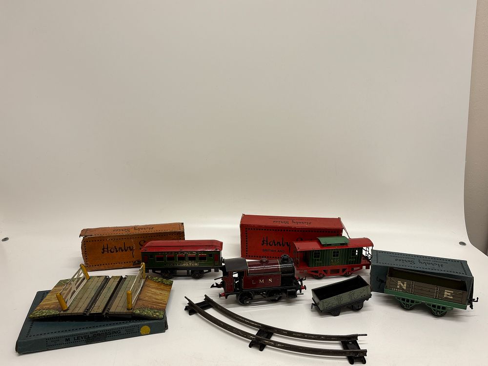Lot 531: A Collection of Hornby Series O Gauge Tinplate Clockwork Model Trains and Accessories