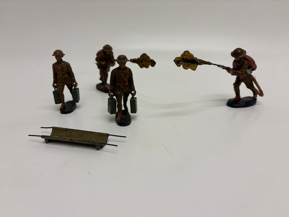Lot 532: A Group of Five Elastolin Composition British Infantry Toy Soldiers and Stretcher Accessory