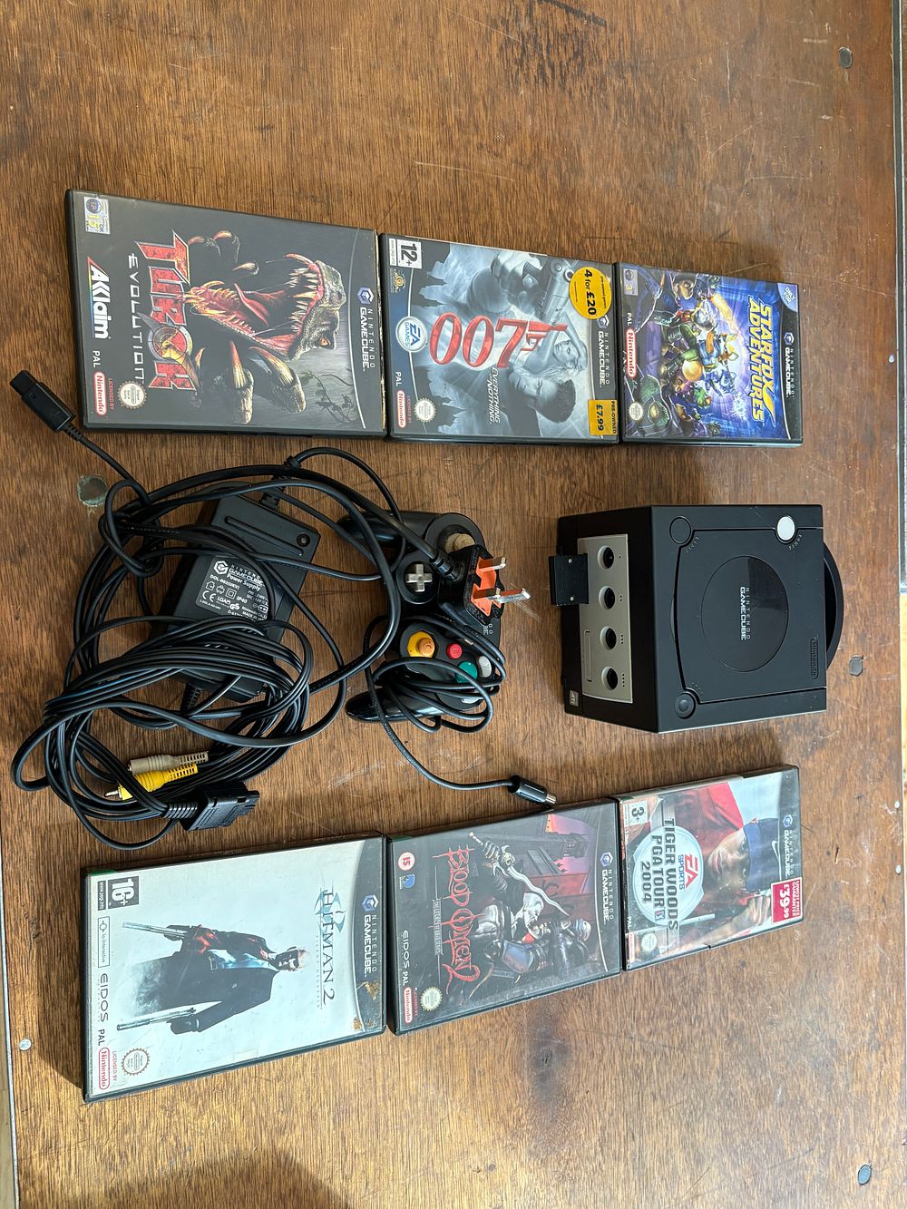 Lot 552: A Nintendo GameCube Home Video Game Console Bundle with Controller, Accessories, and Six Games