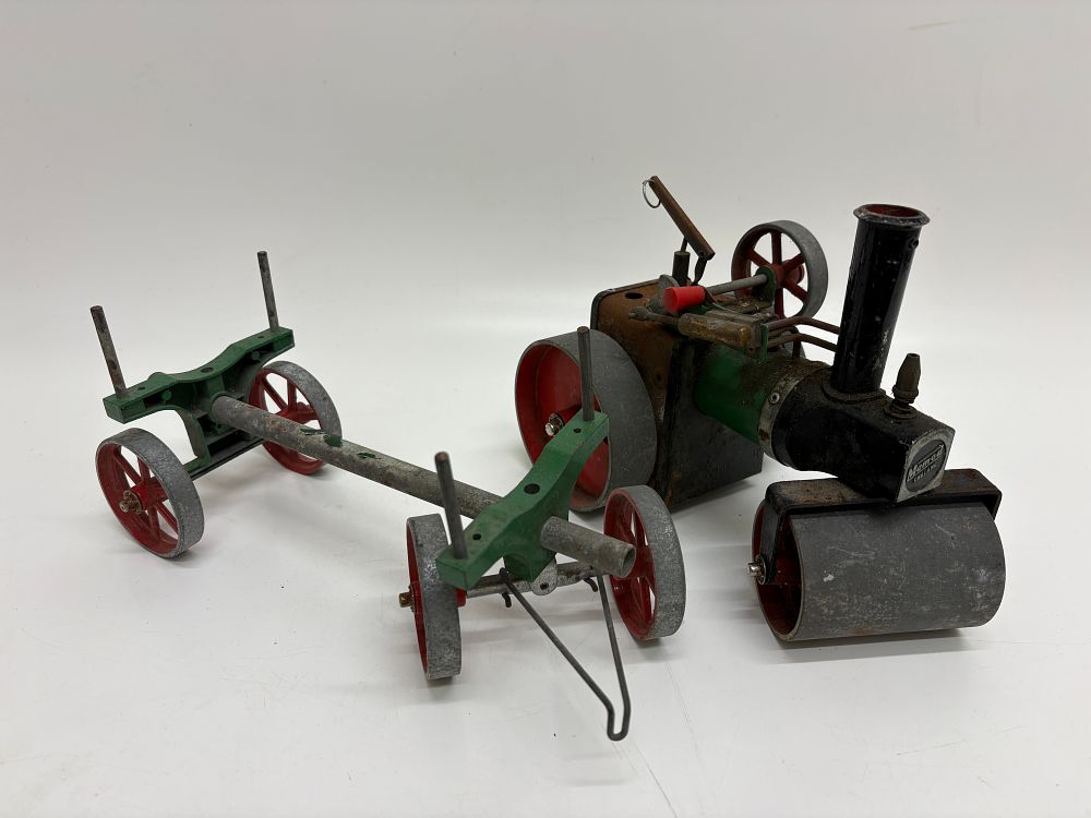 Lot 558: A Mamod Live Steam Road Roller with Trailer and a Painted Wood Toy Fort