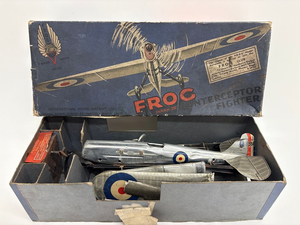 Lot 560: FROG Mark IV Interceptor Fighter tinplate model aircraft with original box