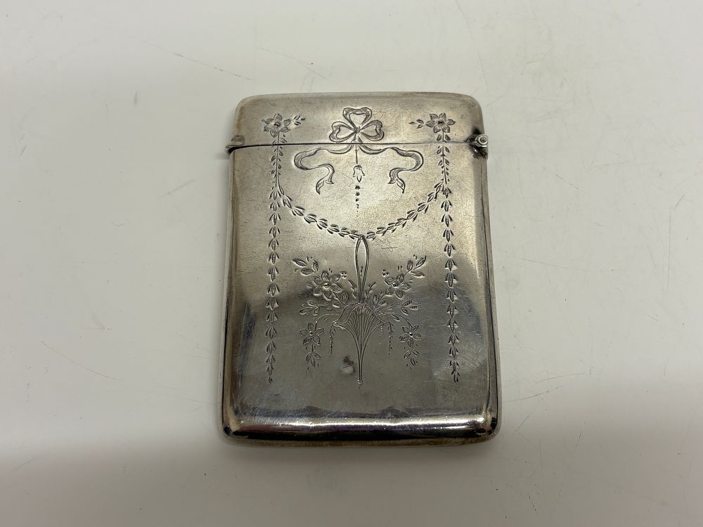 Lot 51: A Sterling Silver Vesta Case with Engraved Floral Basket and Swags circa 76g