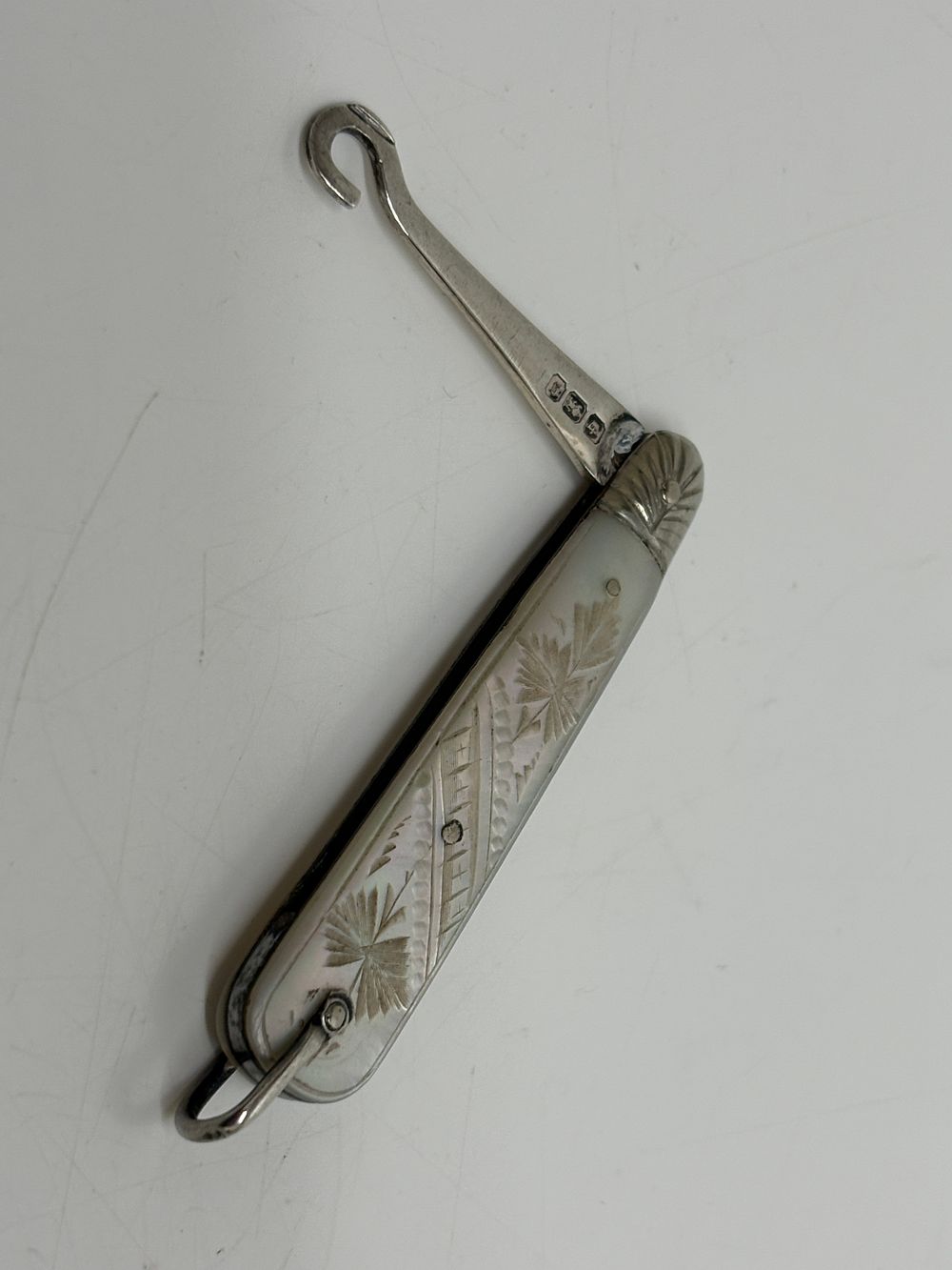 Lot 63: Sterling Silver and Carved Mother of Pearl Folding Button Hook Sheffield 1896