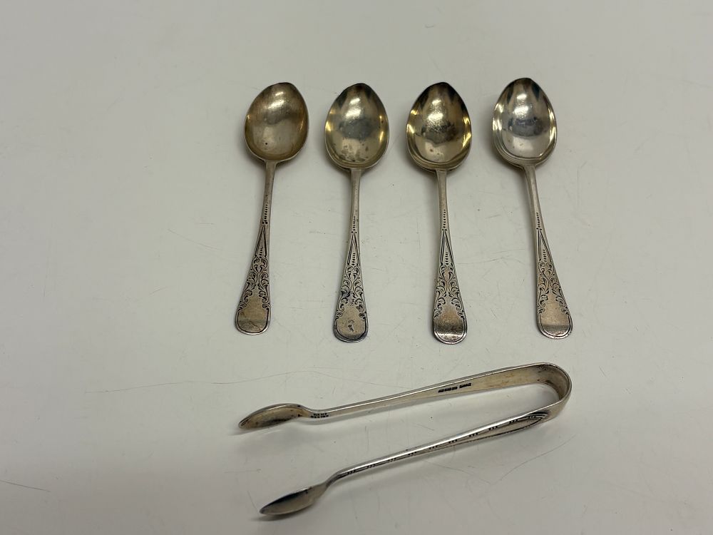 Lot 70: A Group of Edwardian Sterling Silver Teaspoons and Sugar Tongs 70g