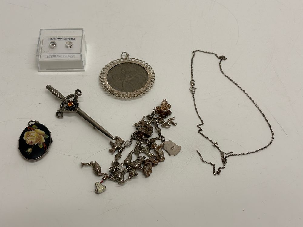 Lot 87: A Collection of some Silver & White Metal Vintage Costume Jewellery Including a Charm Bracelet and Commemorative Coin Pendant
