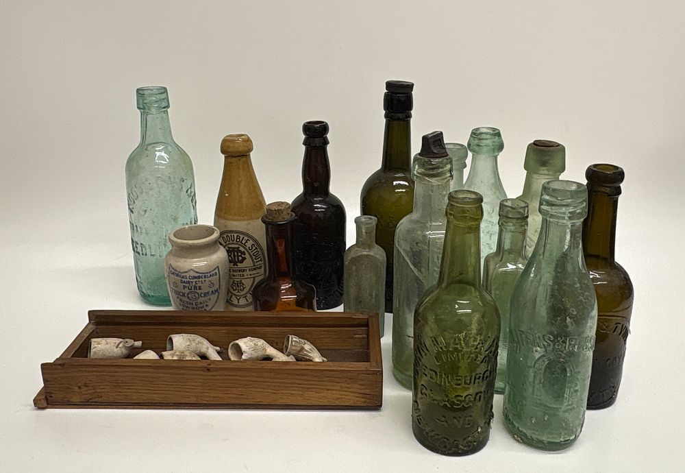 Lot 658: An Assortment of Antique Glass and Stoneware Bottles and Clay Pipe Bowl Fragments