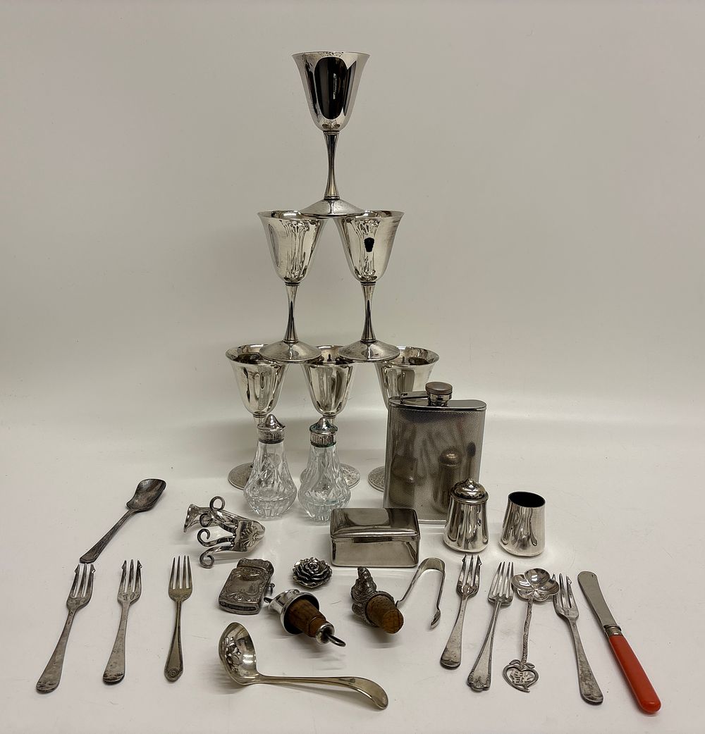 Lot 661: An Assortment of Silver and Silver-plated Tableware, Barware, and Accessories