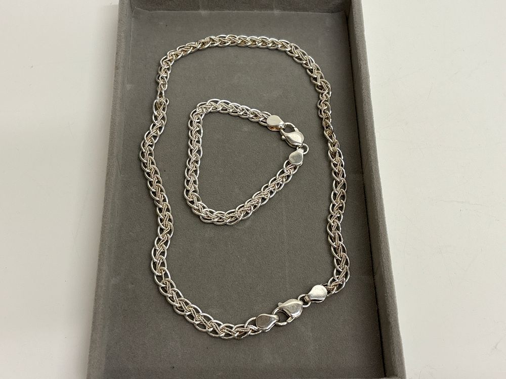 Lot 98: A Matching Sterling Silver Fancy Link Necklace and Bracelet Suite circa 45g