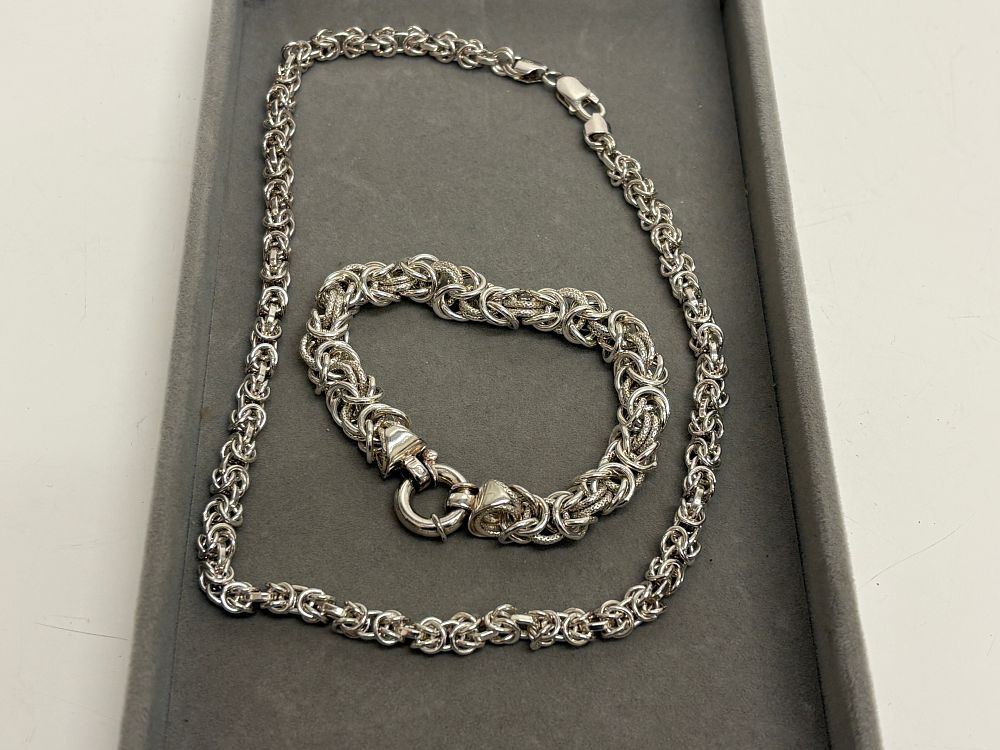 Lot 99: A Sterling Silver Byzantine Chain Necklace and Bracelet Set circa 75g