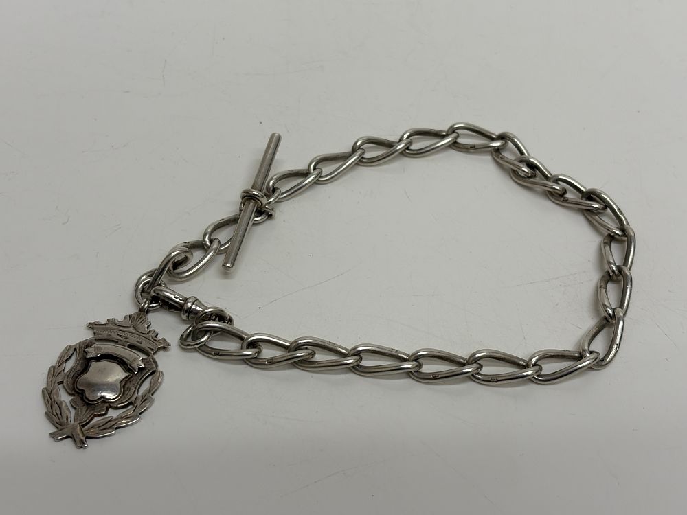 Lot 102: A Sterling Silver Single Albert Watch Chain and Fob circa 50g