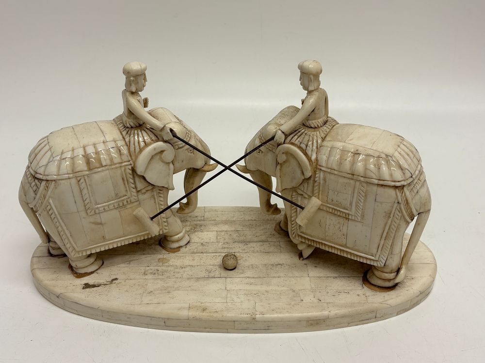 Lot 184: A Pair of Carved Bone Elephant Polo Figures