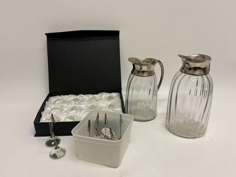 Lot 193: A Pair of Glass Claret Jugs and a Group of Crystal Place Card Holders