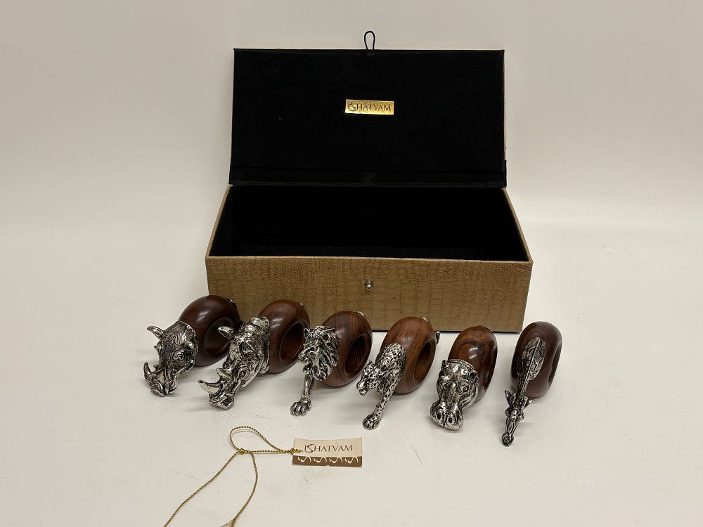 Lot 199: A Group of Ishatvam African Wildlife Themed Wooden and Metal Napkin Rings