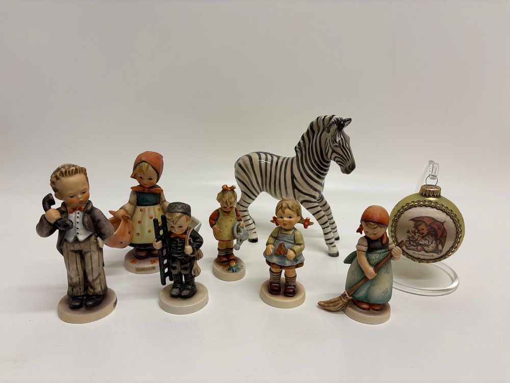 Lot 649: A Collection of Polychrome Ceramic Figurines and a Beswick Zebra