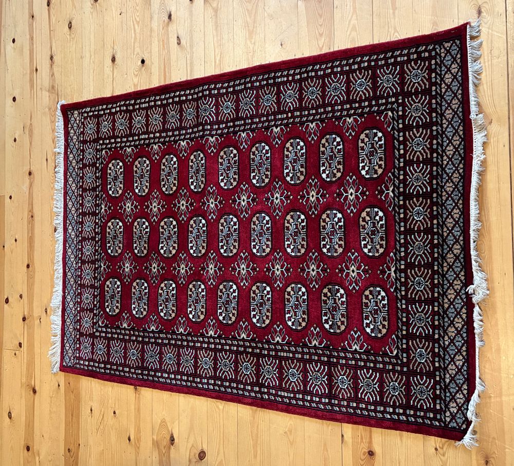 Lot 667: An Indian Bokhara Wool Rug 6ft2" x 4ft 3"