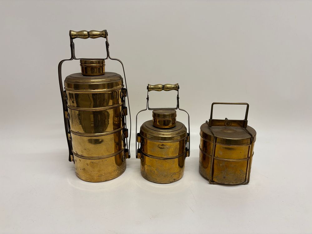 Lot 682: Three graduated vintage Indian brass tiffin boxes