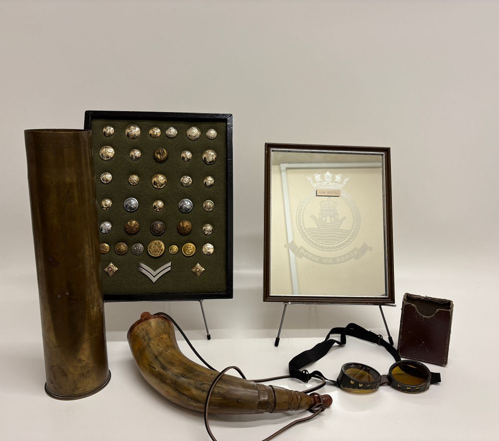Lot 111: An Assortment of British and Commonwealth Militaria including Trench Art and HMS Ark Royal Mirror
