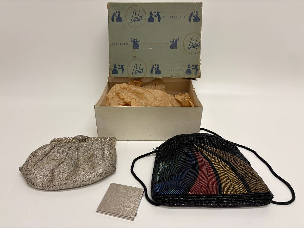 Lot 608: Two Mid-Century Evening Bags and a Silver-Toned Powder Compact with a Daly's of Scotland Box