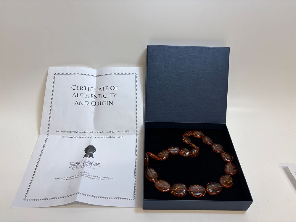 Lot 14: A Baltic Amber Beaded Necklace with Certificate and Presentation Box