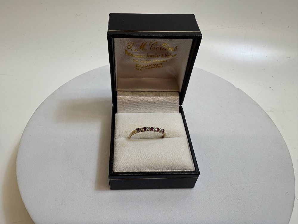 Lot 16: A 9ct Yellow Gold Ruby and Diamond Half-Eternity Ring circa 1.1g gross