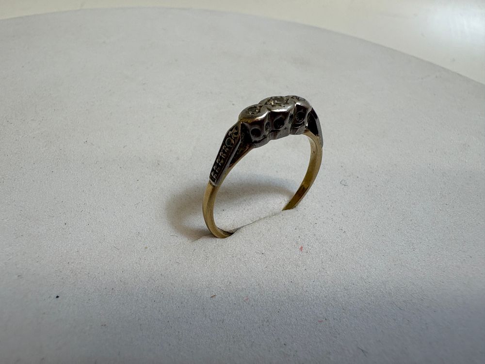 Lot 18: A Vintage 18 Carat Gold and Platinum Diamond Three Stone Trilogy Ring circa 1.95g gross