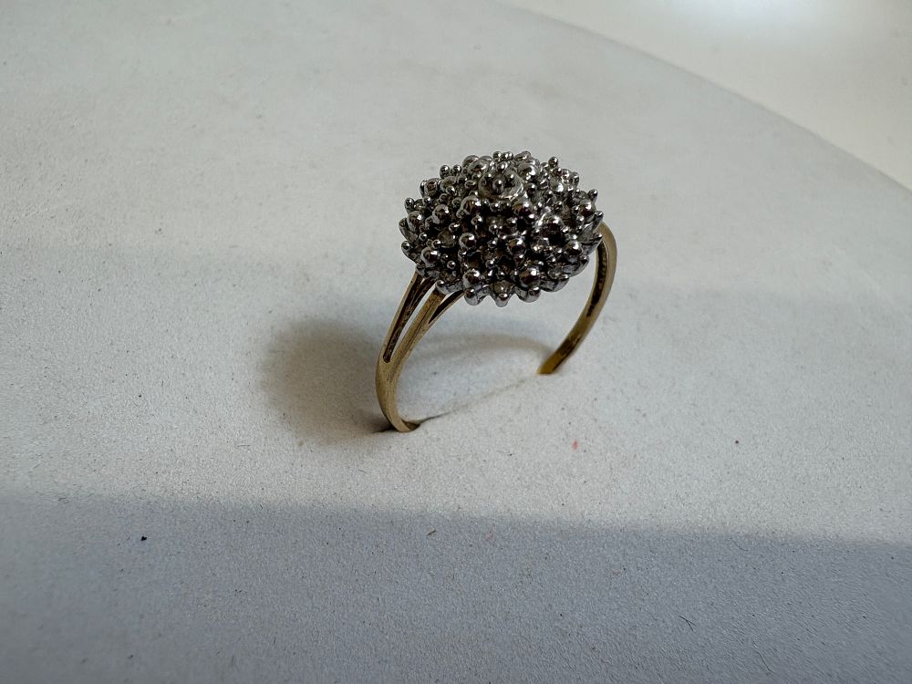 Lot 19: A 9ct Yellow Gold and Diamond Cluster Cocktail Ring circa 2.07g gross