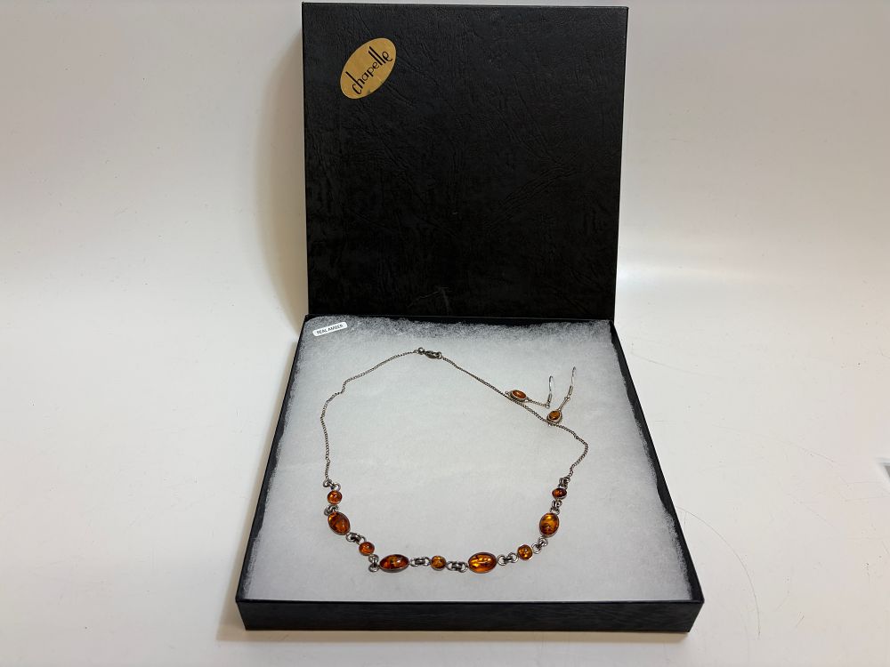 Lot 116: A Pair of Amber Earrings and a Matching Necklace in Chapelle Presentation Box