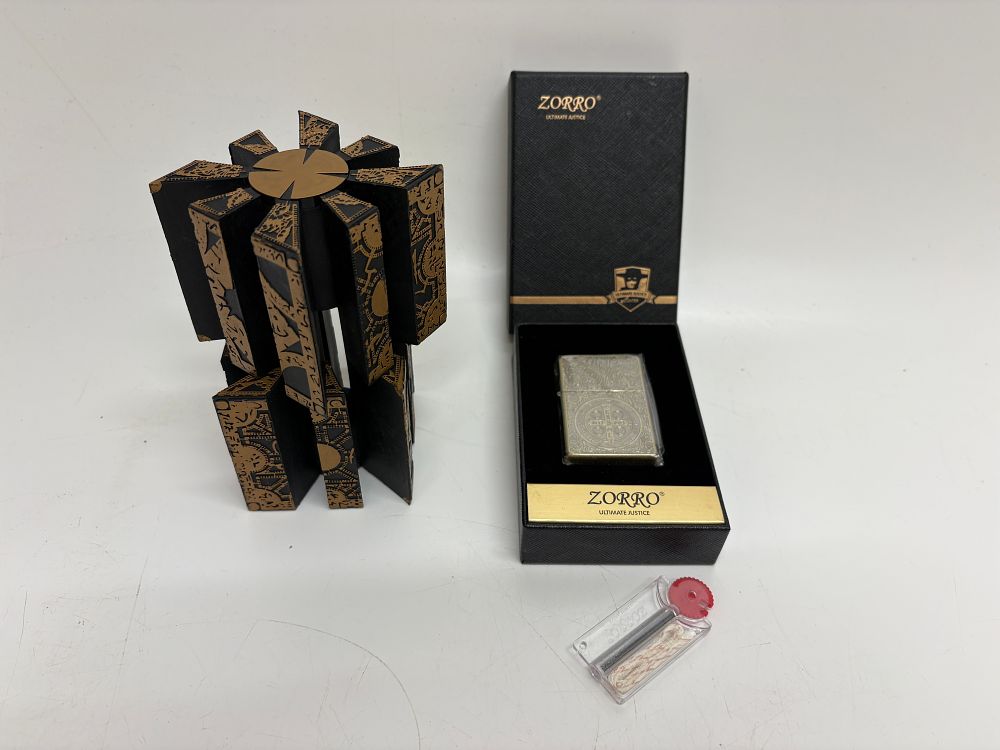 Lot 235: A Zorro Ultimate Justice Lighter Set and a Hellraiser Style Novelty Puzzle Box