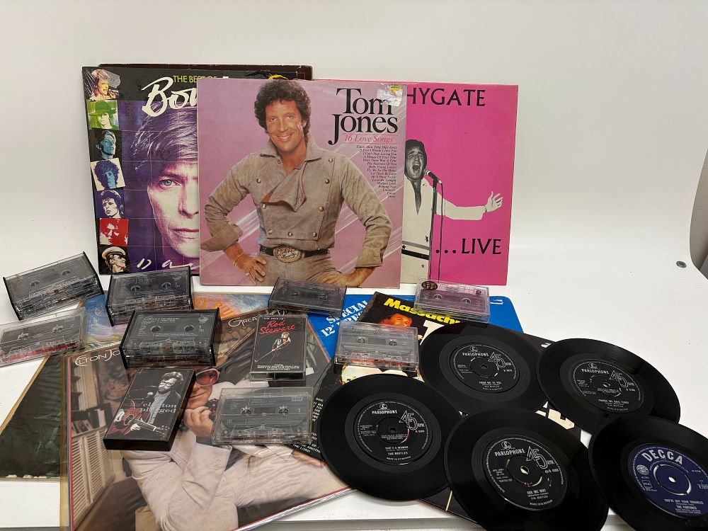 Lot 238: An Assortment of Vintage Music Media including Vinyl LPs, 7-inch Singles and Cassette Tapes