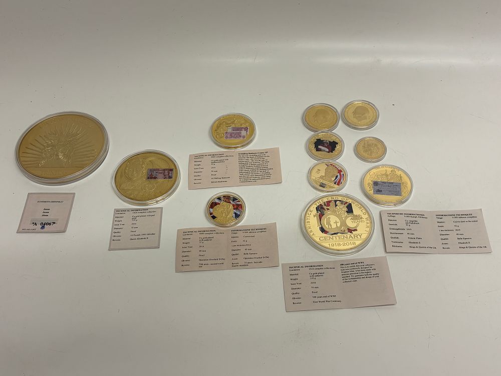 Lot 616: A Collection of UK and Gibraltar Gold-Plated Commemorative Medals and Coins