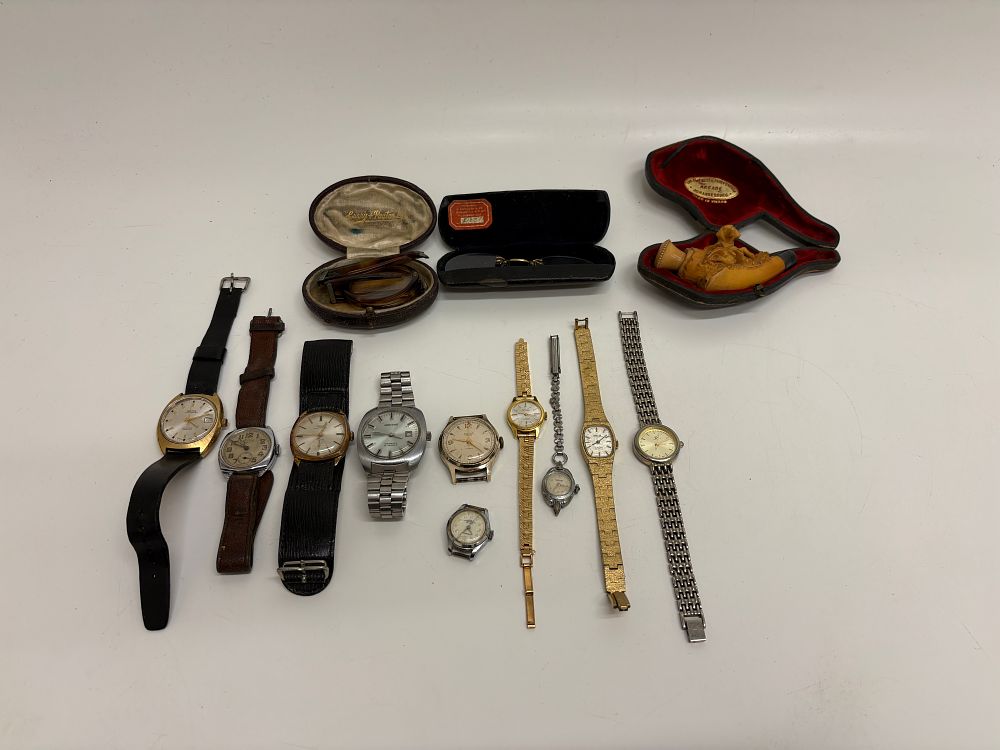 Lot 613: A Collection of Vintage Wristwatches, Eyewear, and a Carved Meerschaum-Style Pipe