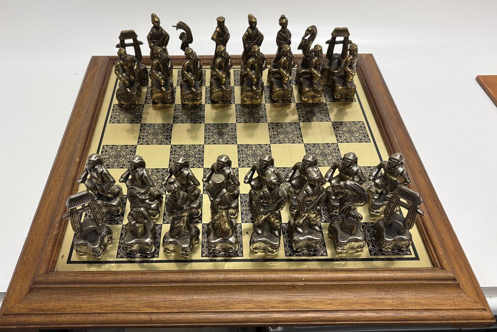 Lot 708: An Italfama Eastern Themed Figurative Metal Chess Set and Board