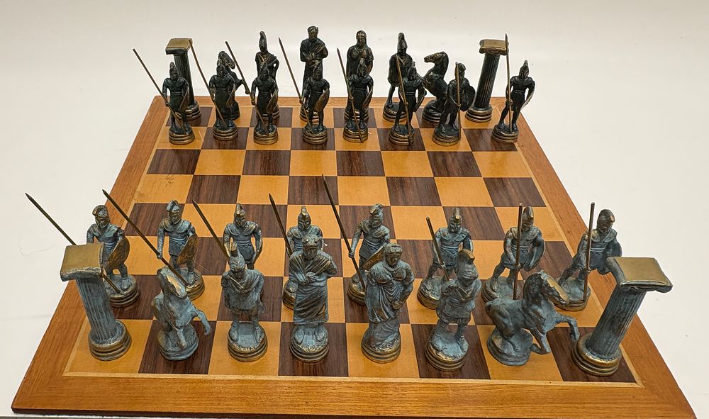 Lot 709: A Themed Figural Metal Chess Set with Wooden Board
