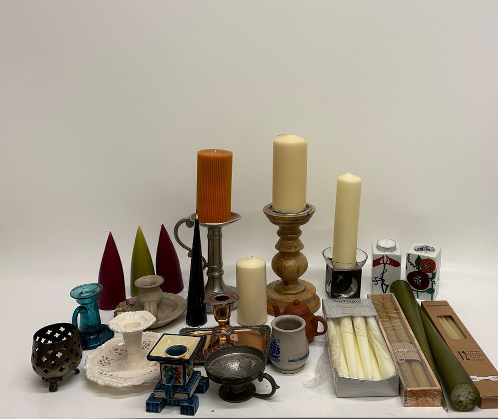 Lot 715: An Assortment of Decorative Pillar, Taper, and Novelty Candles with Mixed Candle Holders