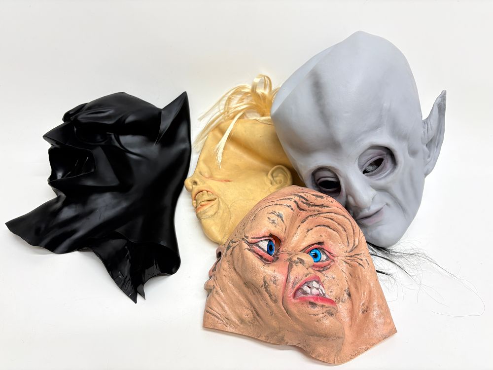 Lot 719: A Collection of Four Character Masks including Batman, Sloth, Gollum and Outer Limits Alien