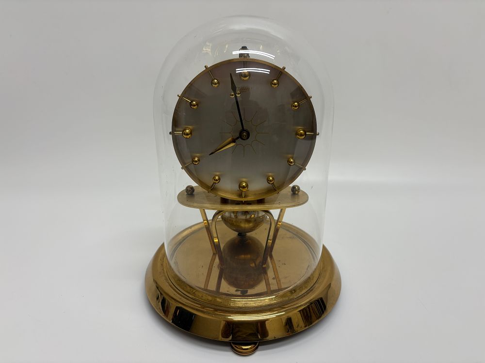 Lot 720: A Vintage German J. Kaiser GmbH Gilded Metal Anniversary Clock with Globe Pendulum